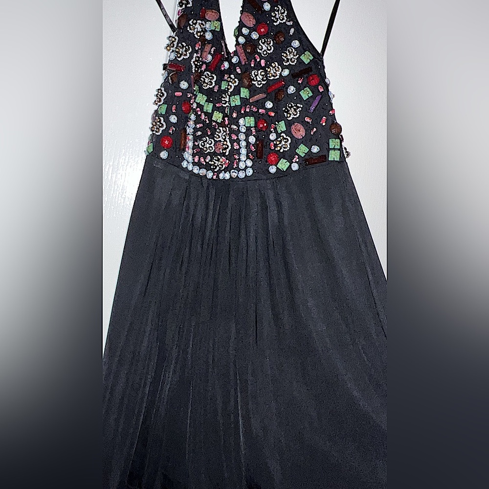 Beautiful halter dress with gorgeous stones and open back .